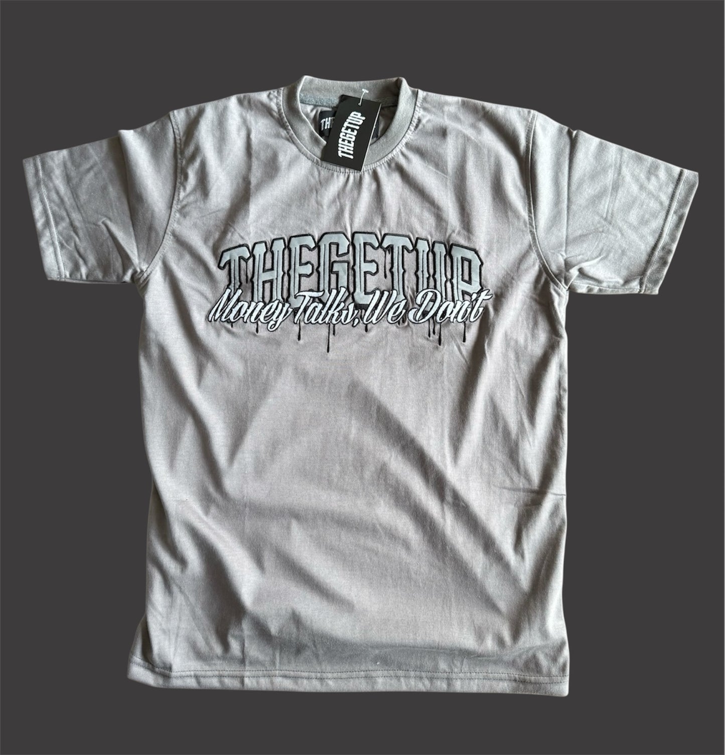 Grey on grey “THEGETUP Money Talks, We Don’t” t-shirt