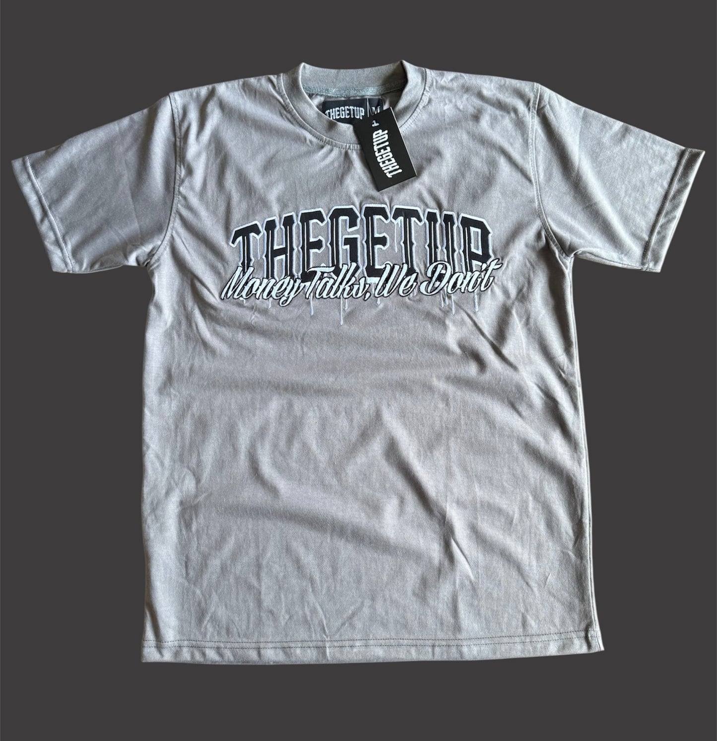 Black on grey “THEGETUP Money Talks, We Don’t” t-shirt